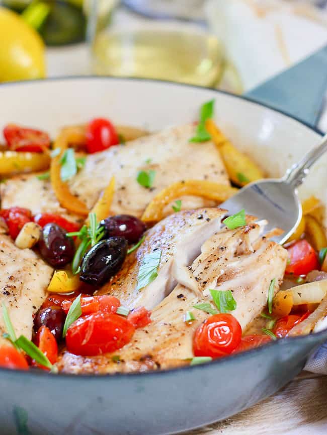 Healthy Fish in a blue skillet being ready to serve