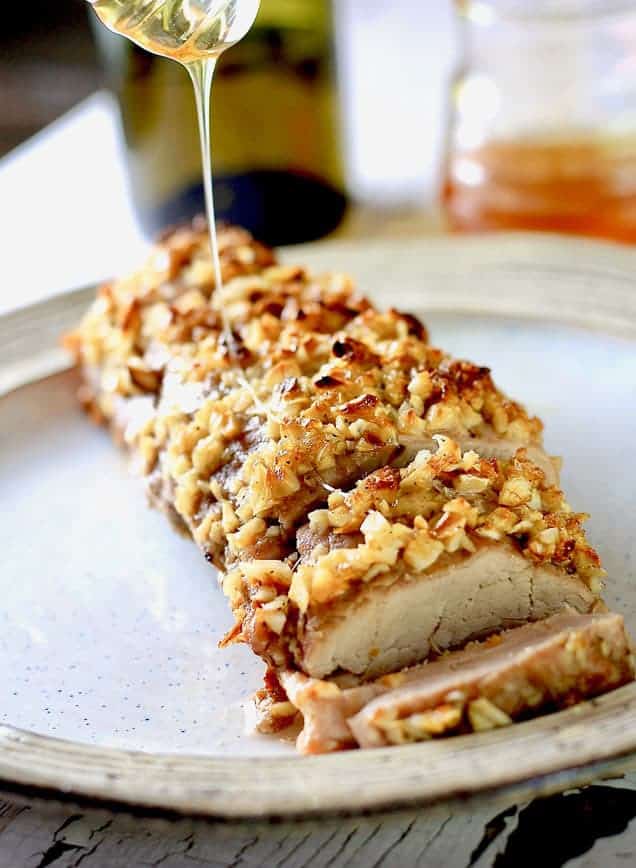 brown sugar pork loin on a plate with honey drizzle