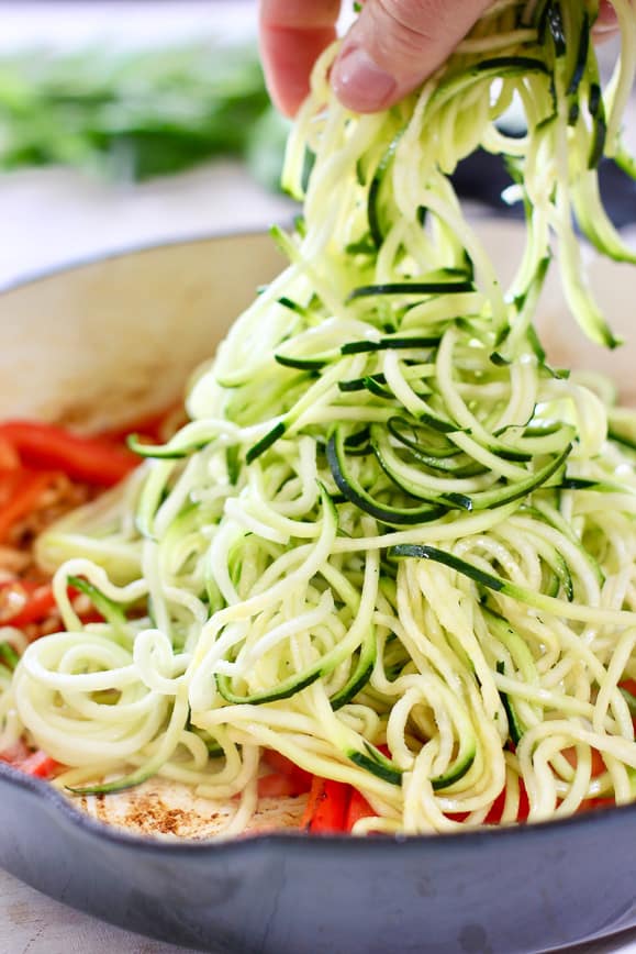 Zoodles being added to hot pan