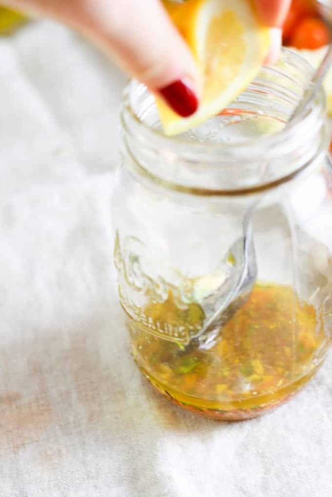 mixing dressing in mason jar