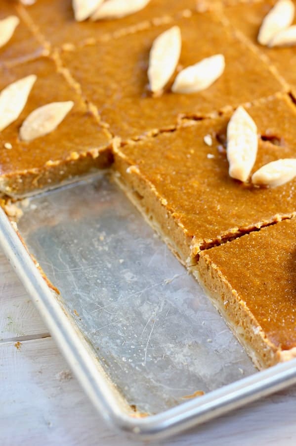 sheet pan pumpkin pie garnished with puff pastry 