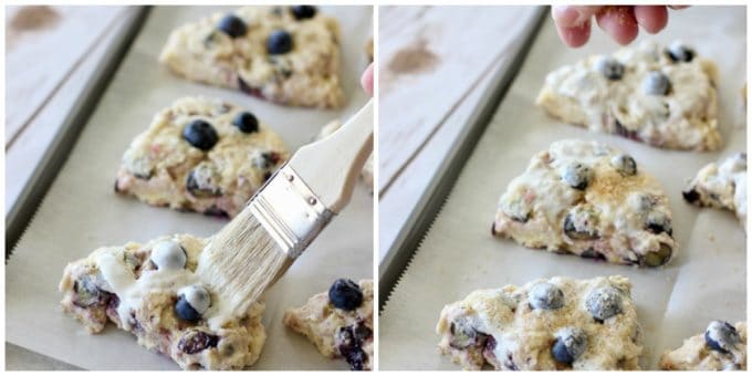 scones being brushed with cream and sprinkled with sugar