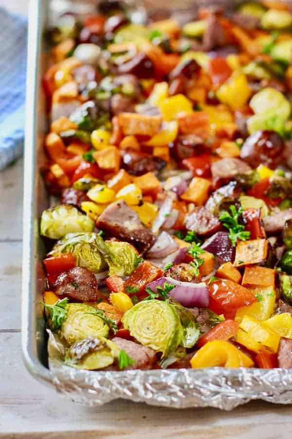 baked sausage and veggies on a sheet pan