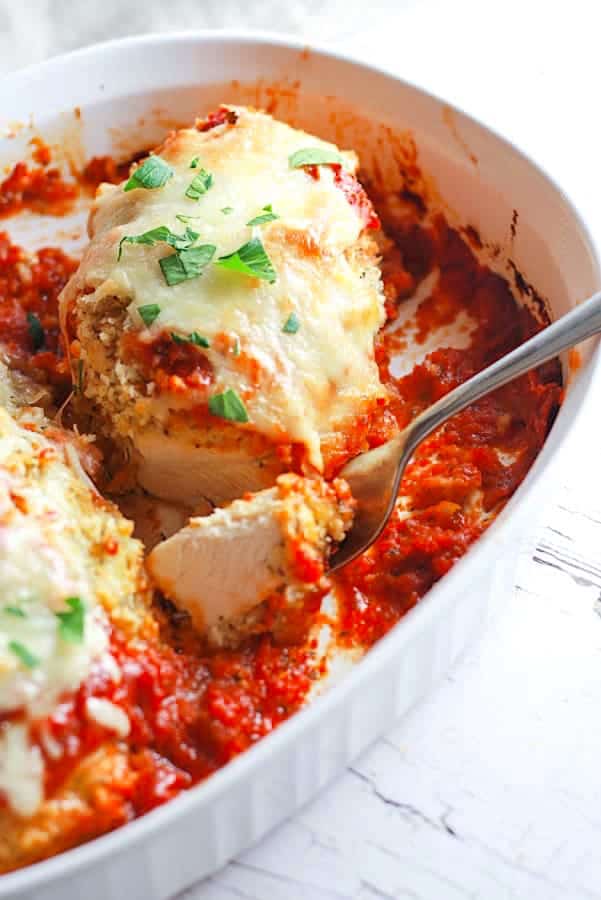 double coated baked chicken parmesan in casserole dish