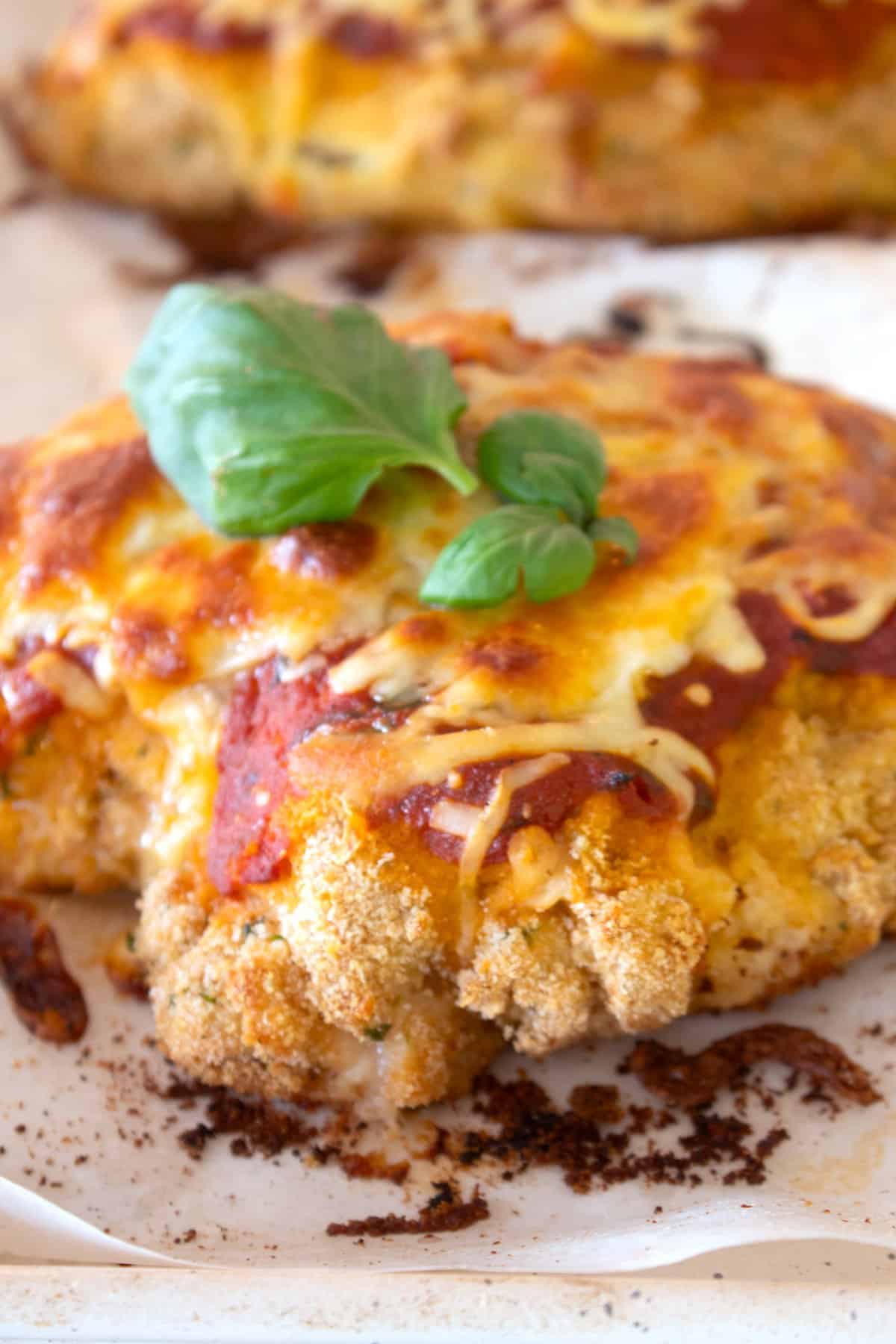 closeup picture of baked chicken parmesan
