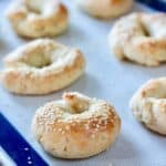 bagels with sesame on a silpat cooking sheet