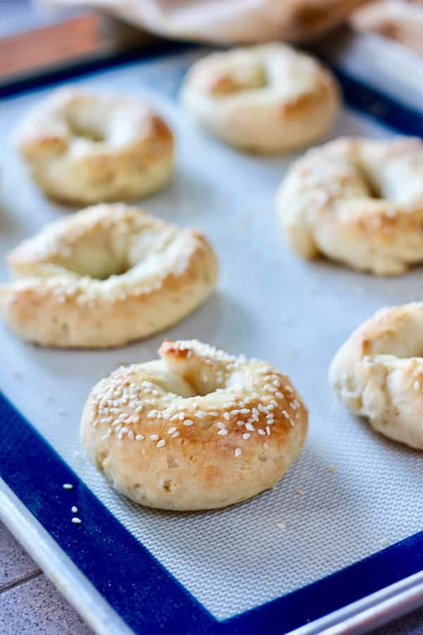 bagels with sesame on a silpat cooking sheet