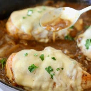 French onion chicken being smothered in gravy
