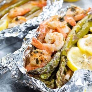 Shrimp and asparagus with lemon in foil pack