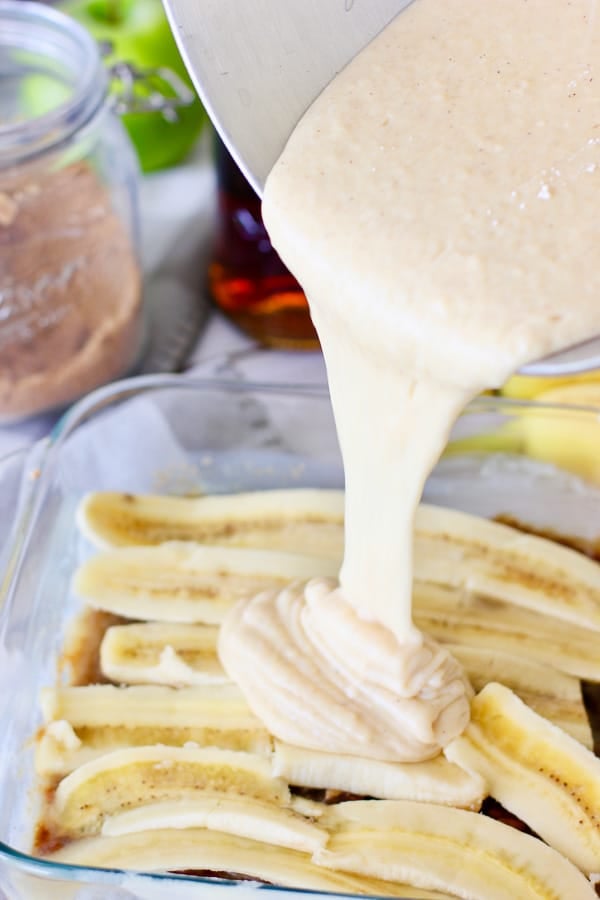 cake batter poured on top of banana and sugar mixture