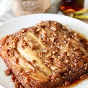 banana foster cake on a white platter