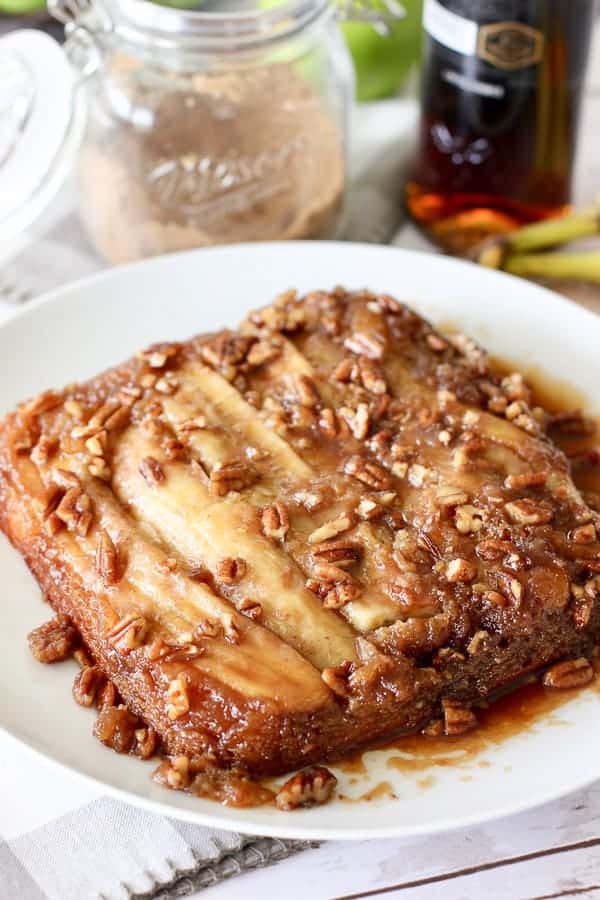 banana foster cake on a white platter