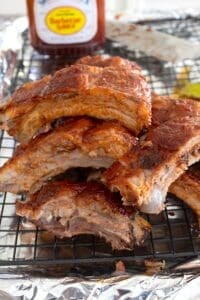 overhead view of ribs with bbq sauce in the background