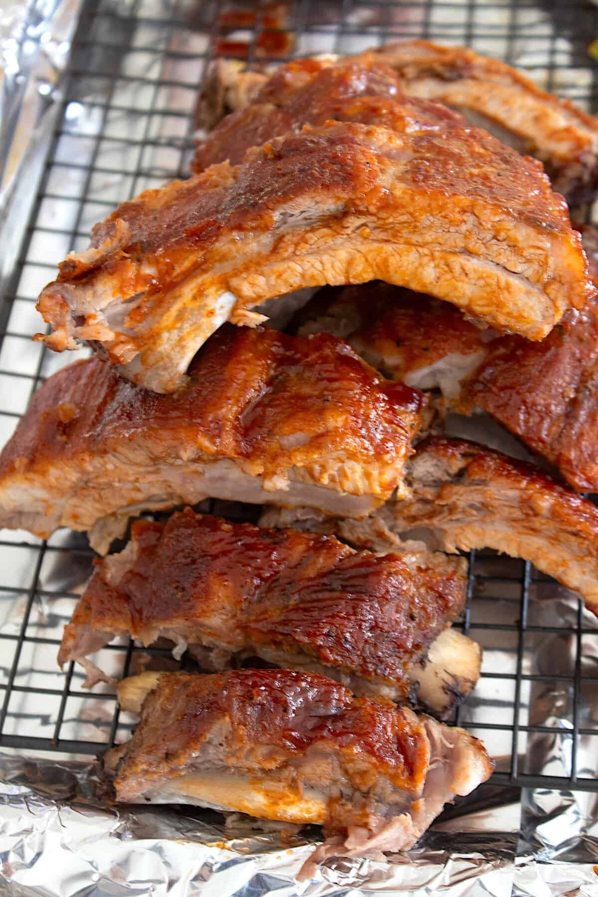 ribs stacked on a wire rack