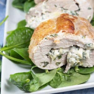 a platter with spinach stuffed pork