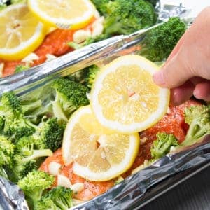 Salmon with lemon garlic and broccoli in foil pouch