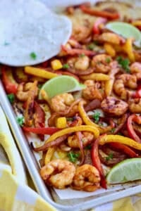 Shrimp Fajitas served with torillas on a sheet pan
