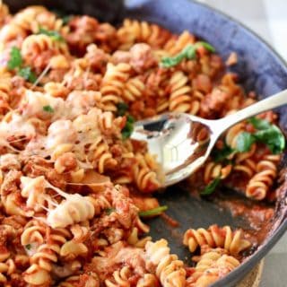 pasta in a cast iron pan being served