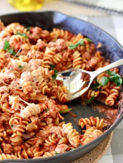 pasta in a cast iron pan being served