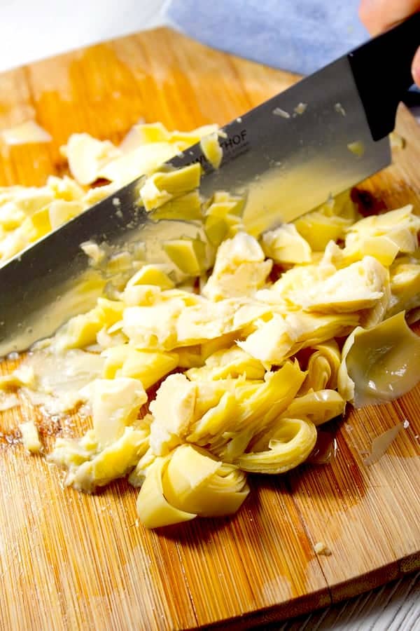 chopping artichokes for stuffed tenderloin mixture