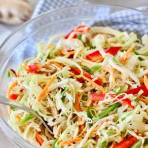 Asian Slaw with Ginger Peanut Dressing in a glass bowl