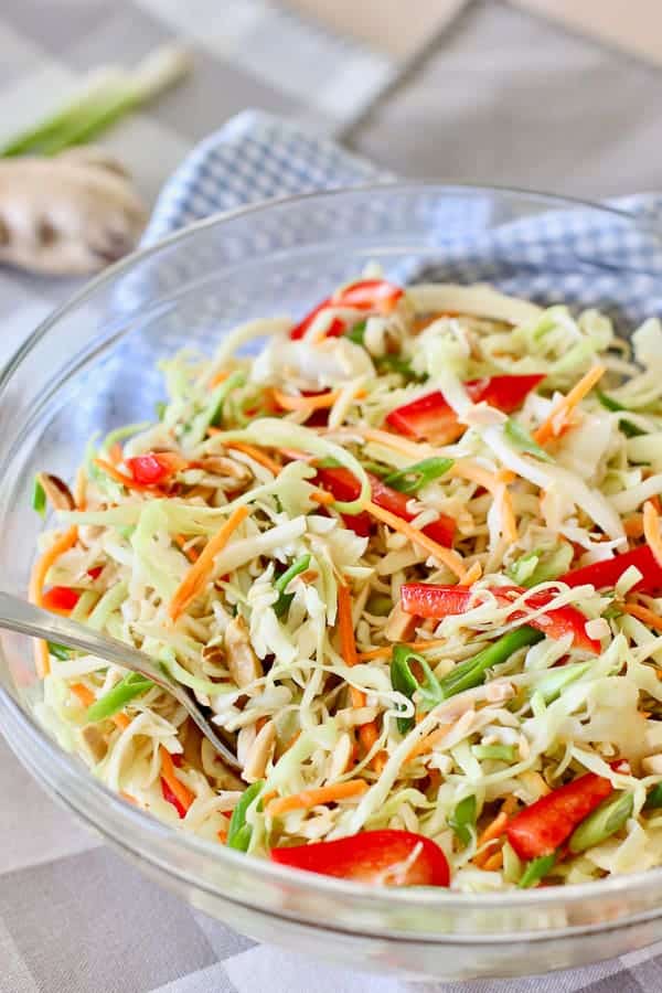 Asian Slaw with Ginger Peanut Dressing in a glass bowl