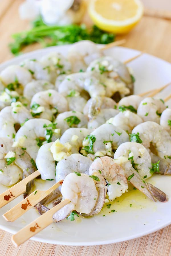 grilled shrimp threaded onto skewers and ready to cook