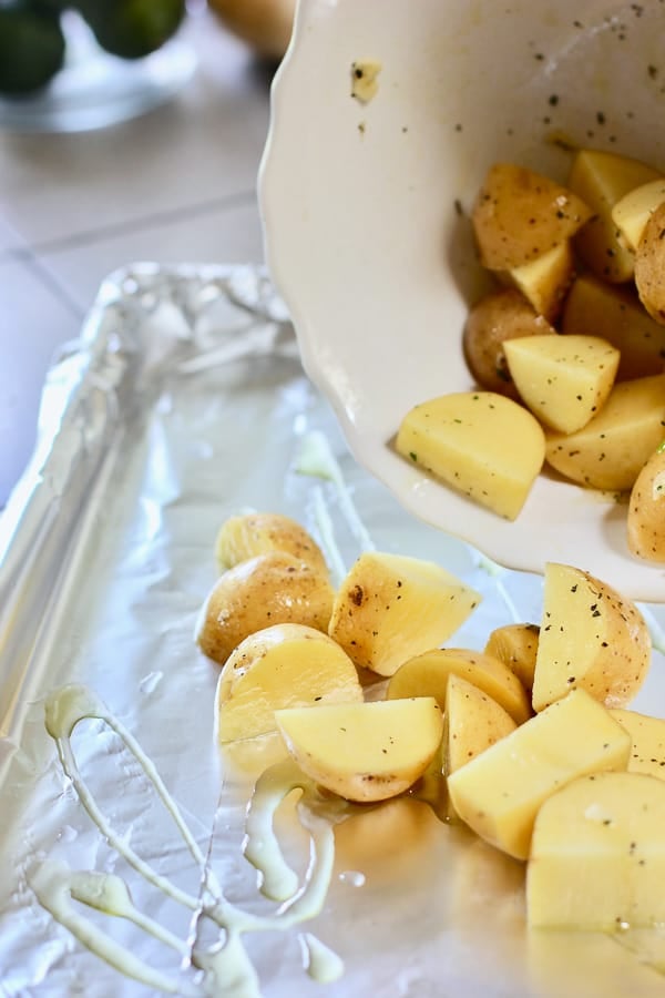 golden potatoes cut up in quarters