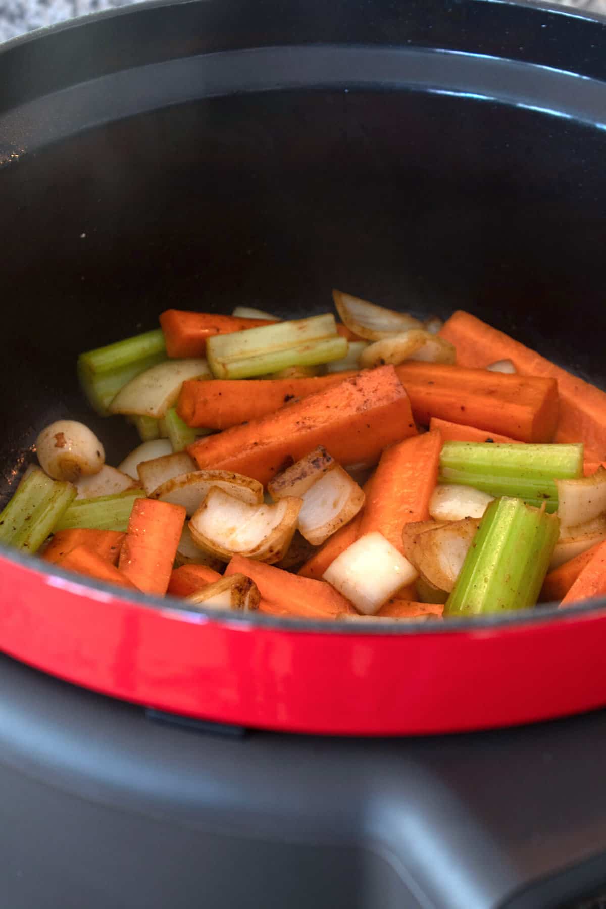 browned mirepoix in a slow cooker