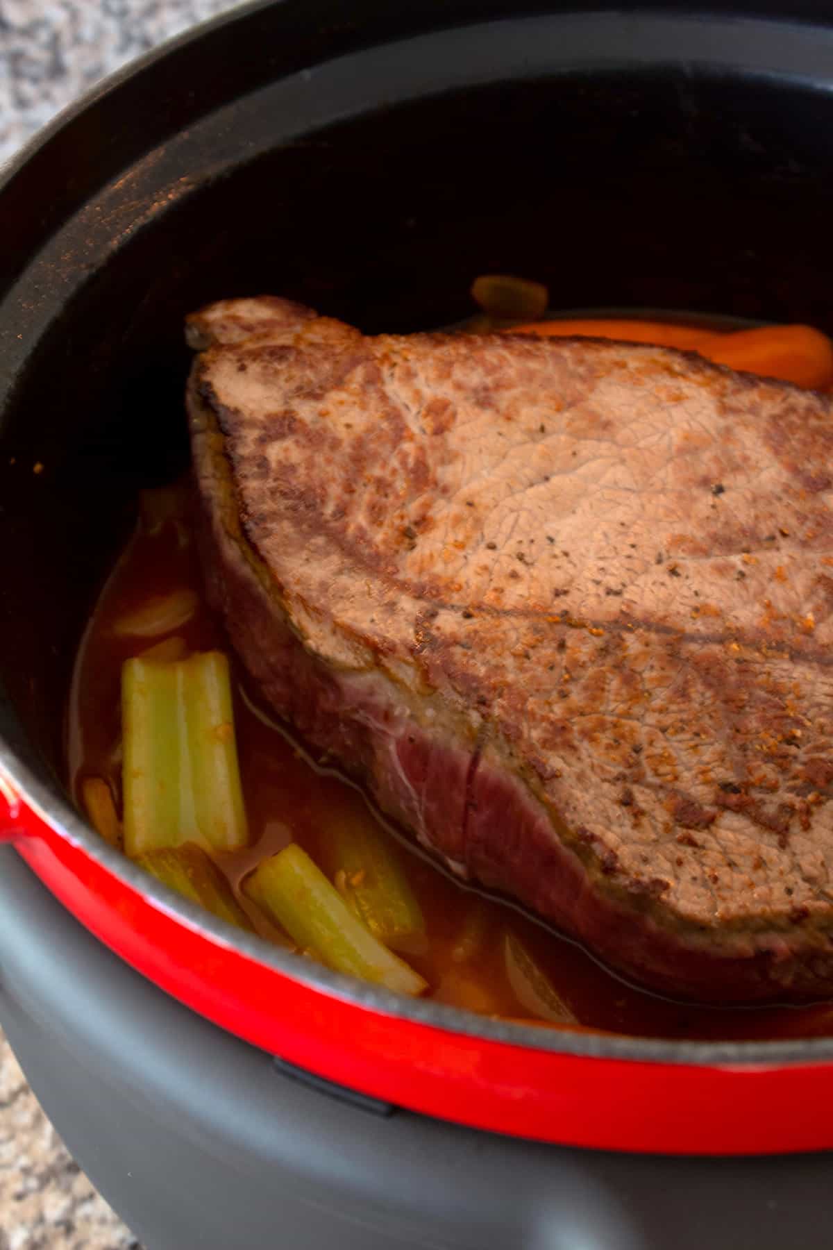 pot roast in dutch oven with veggies