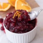 orange cranberry sauce with a spoon