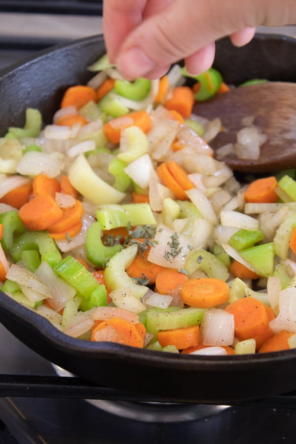 chopped mirepoix in a cast iron skillet
