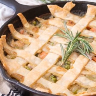 chicken pot pie fresh out of the oven in a black cast iron skillet