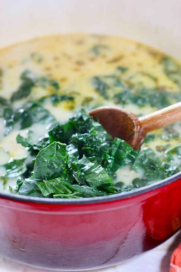 kale into pot of soup