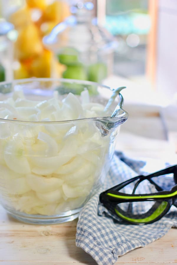 sliced onions in a glass bowl