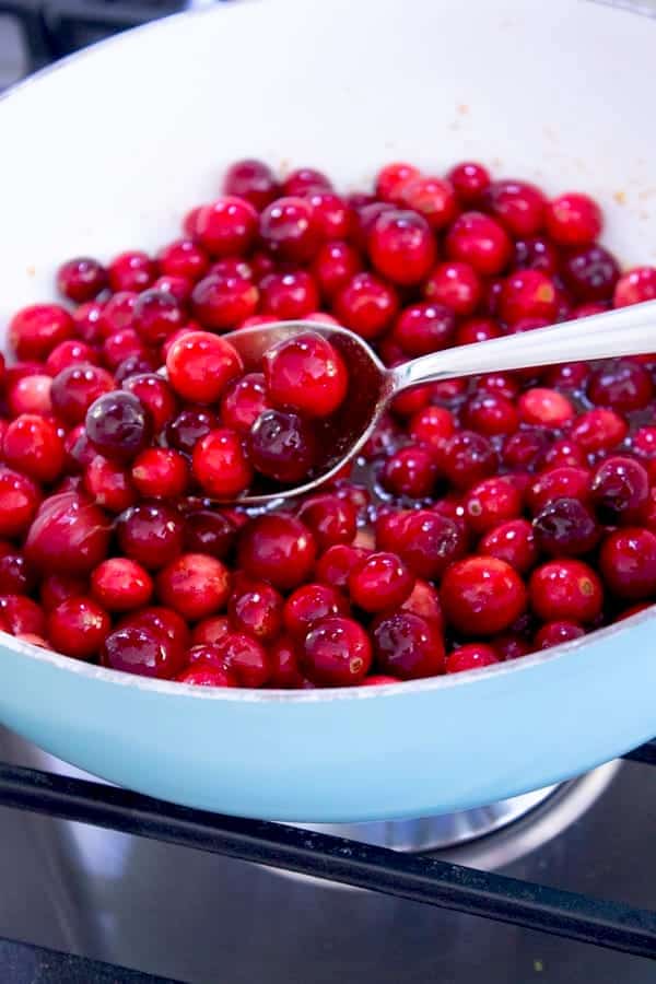 showing whole cranberries in white pan