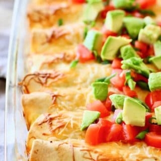 breakfast burritos in a clear casserole dish