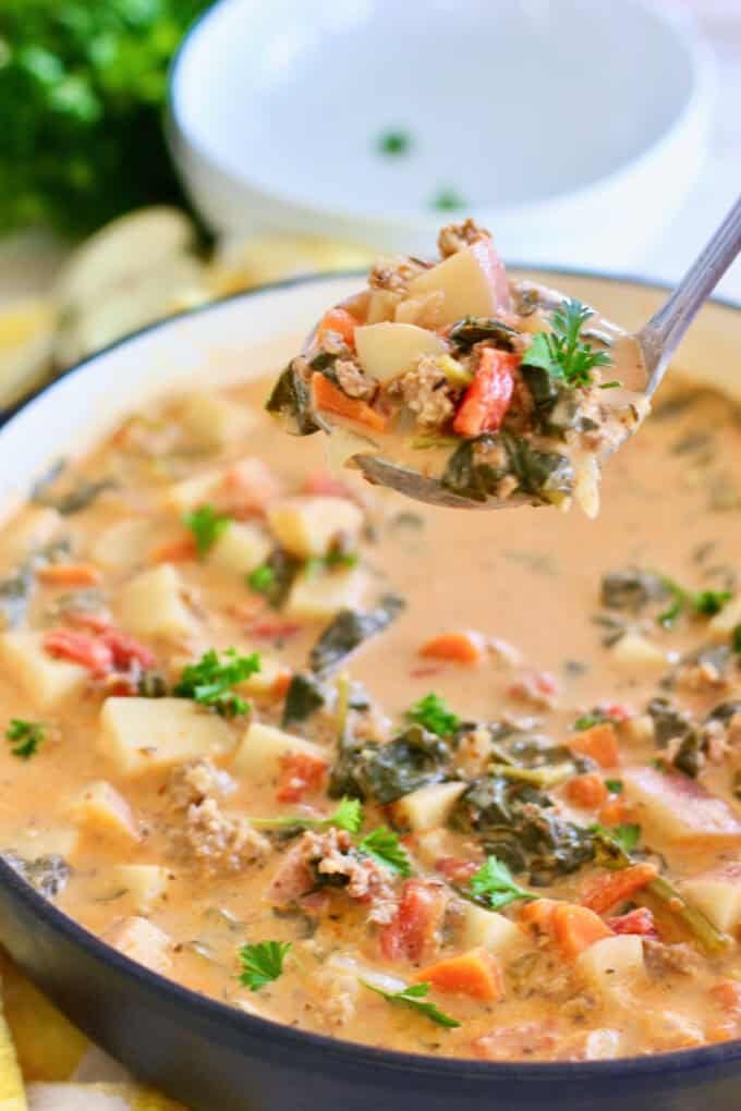 Sausage and Potato soup with a ladle