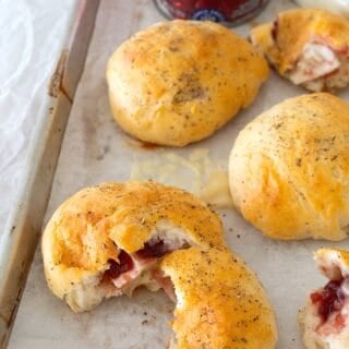 overhead view of cranberry brie biscuits on a sheet pan