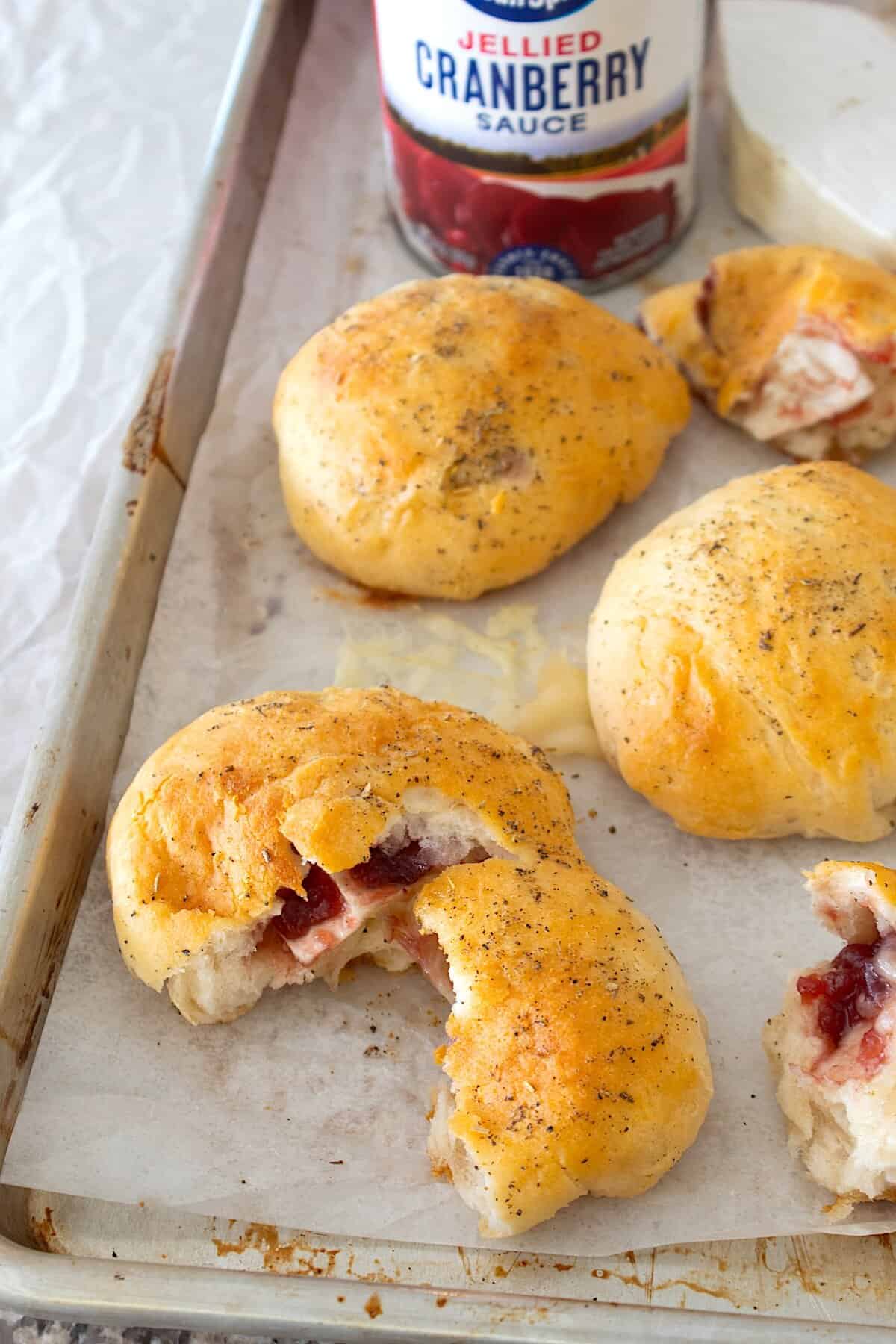 overhead view of cranberry brie biscuits on a sheet pan