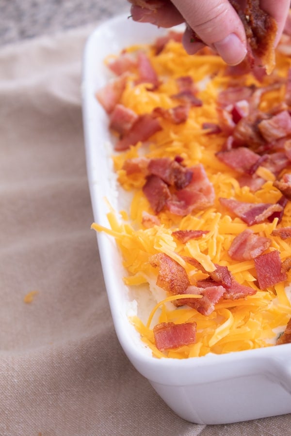 adding bacon to loaded mashed potatoes
