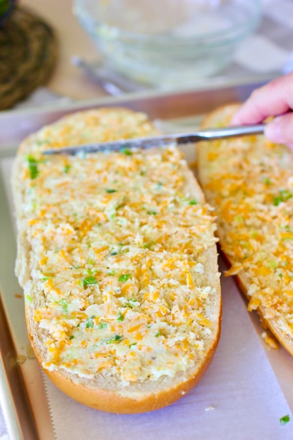 butter and cheese spread onto store bought loaf of bread