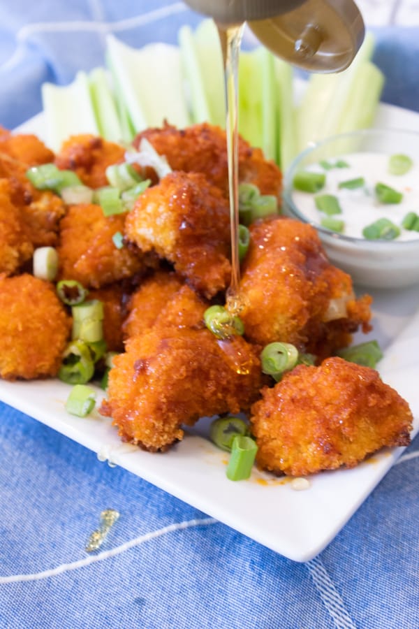 drizzling buffalo bites with honey