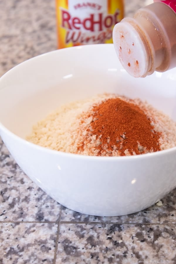 premix panic seasoning in a white bowl to prep for cauliflower buffalo bites