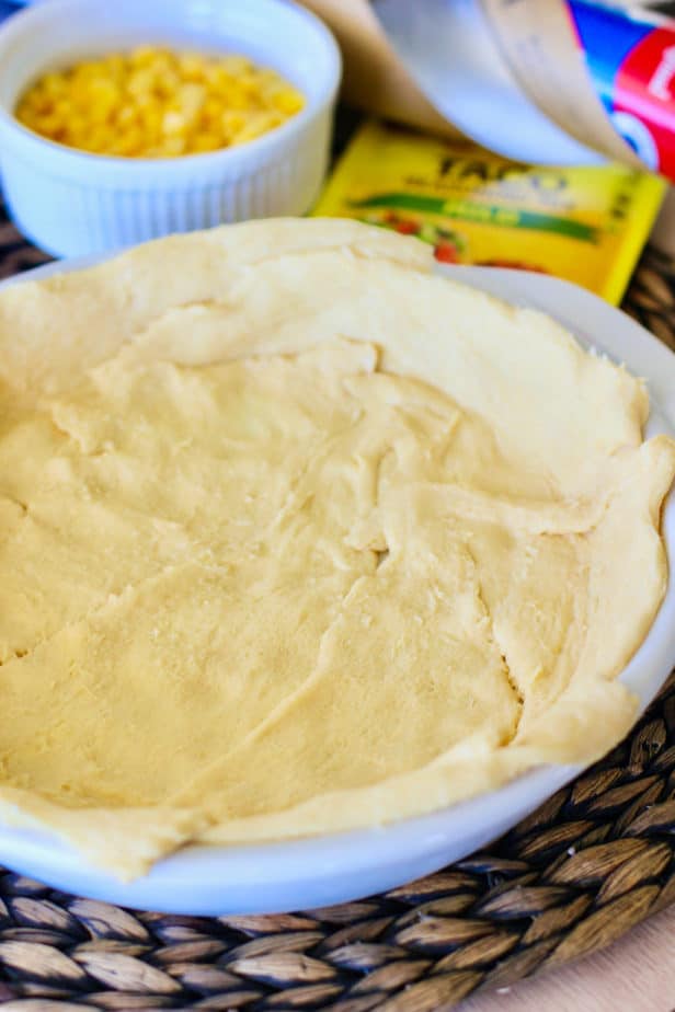 cresent rolls lining a pie plate