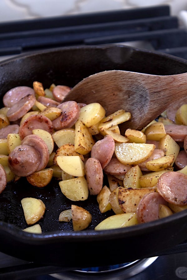 sauteeing sausage and potato in cast iron skillet