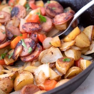 Sausage and Peppers in a cast iron skillet