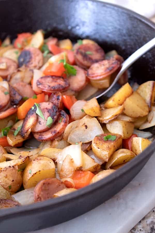 Sausage and Peppers in a cast iron skillet