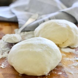 two pizza dough ready to bake