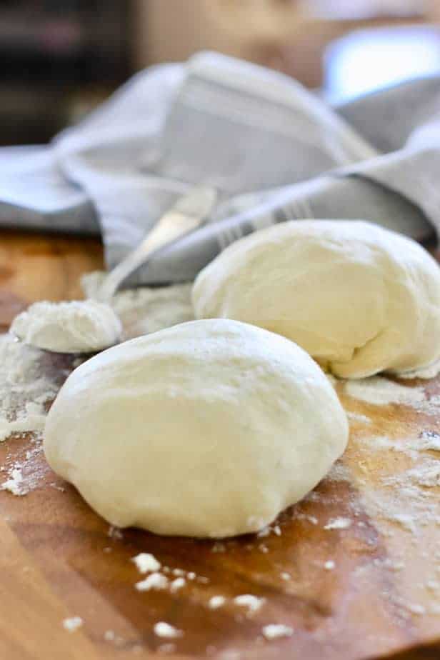 two pizza dough ready to bake